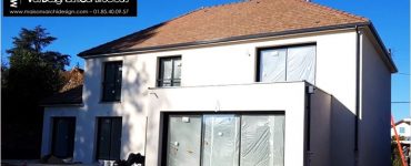 Maison Joa 2 a etage 4 pans avec decroche toit plat grandes baies vitrees aluminium couleur maison architecturee en essonne archidesign